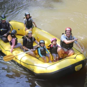 Family with children in the Mini Rafting boat on the Jacaré Pepira River in Brotas