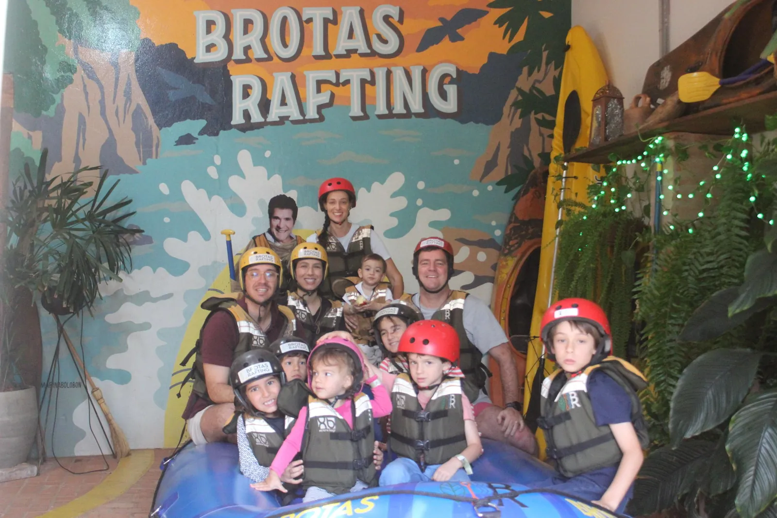 Group wearing life jackets and helmets at the Brotas Rafting base before Mini Rafting