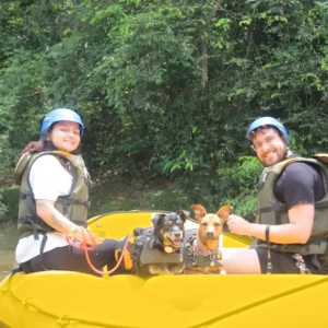 Pet Rafting in Brotas: couple with two dogs wearing life jackets in the boat